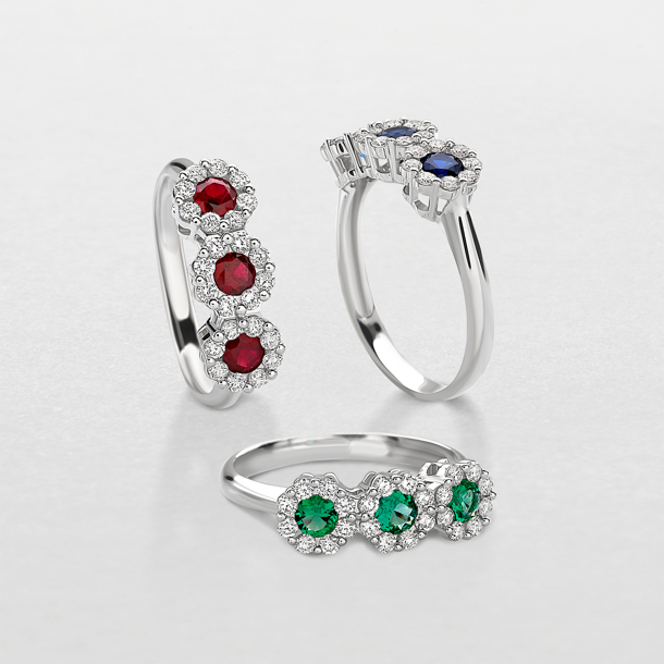 white gold with diamonds and precious color stones ring