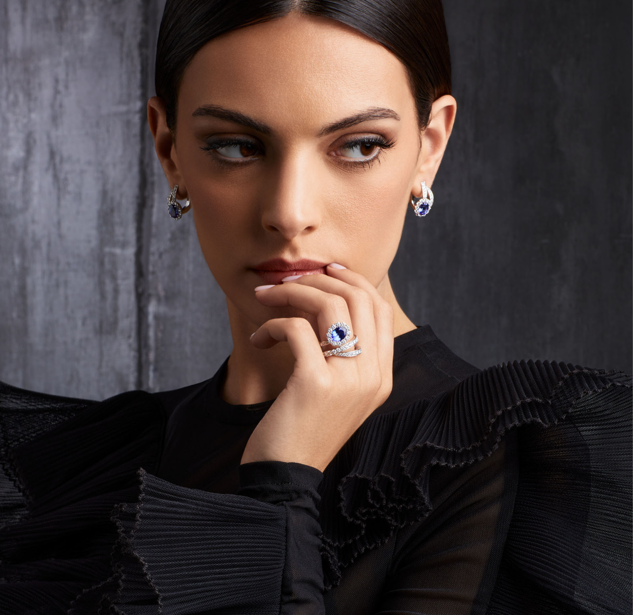 Woman (model) wears earrings and ring in white gold with diamonds and color stone - discover the collection Like Me Chapter Two